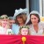 Kate on the balcony with her mum and bridesmaids