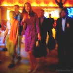 kate in a purple wrap print dress