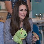 Duchess Kate plays with a frog puppet © shootingstarchase.org.uk