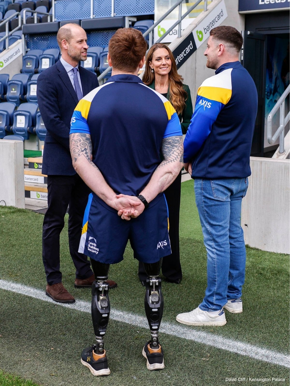 The pair talk to players beside the stands
