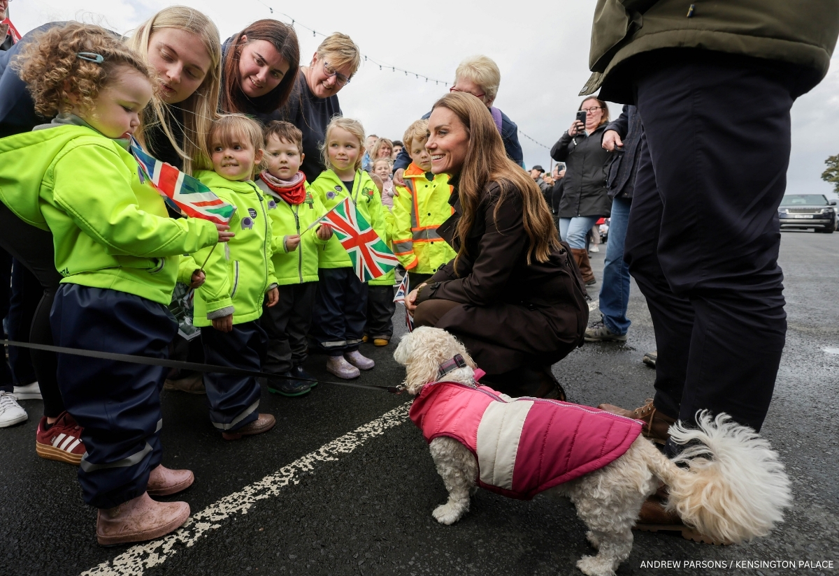 Kate Middleton greeting children and a dog during a walkabout in Rothesay on the Isle of Bute