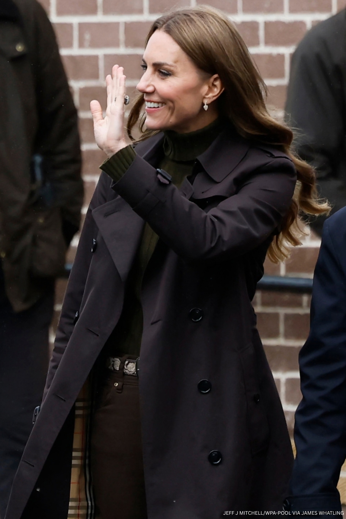 Kate Middleton dressed in brown and green arriving at the Shinty Club