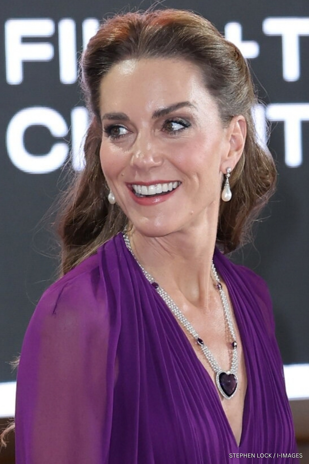 Kate Middleton wearing a purple Jenny Packham dress and heart necklace at the Digger film premiere in London