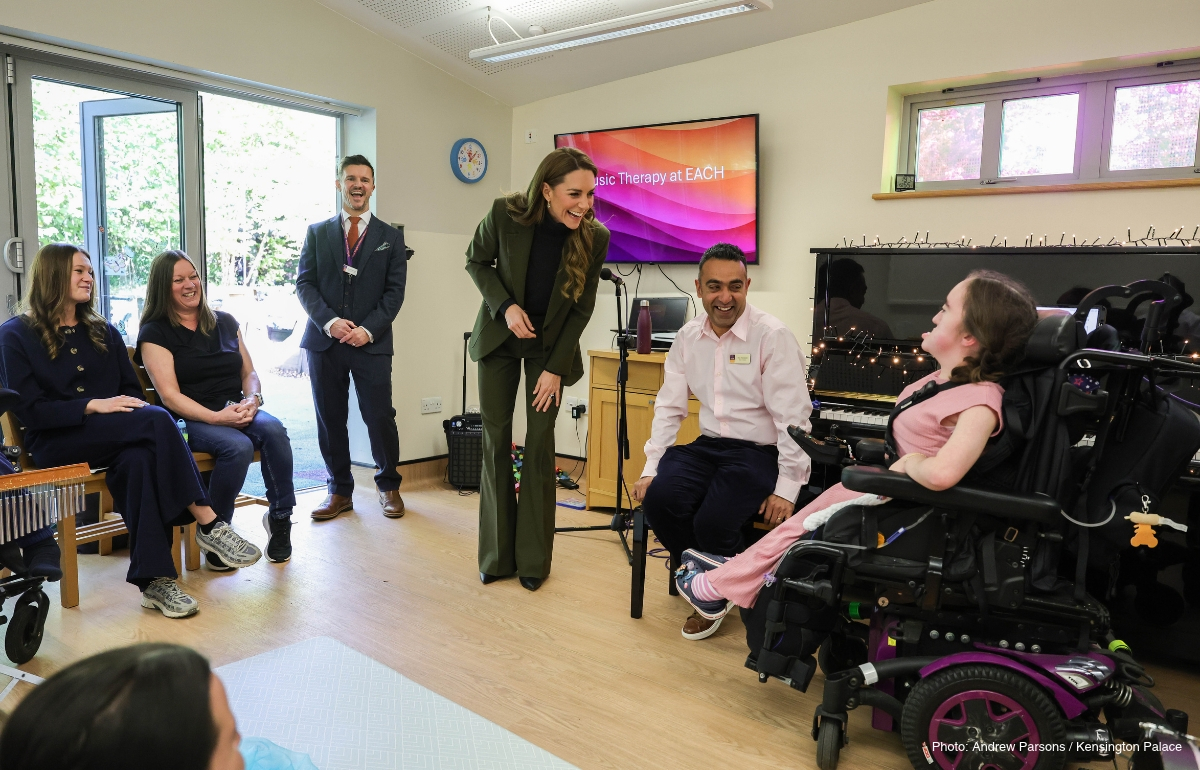 Kate Middleton chatting with children and adults in the music room at The Treehouse