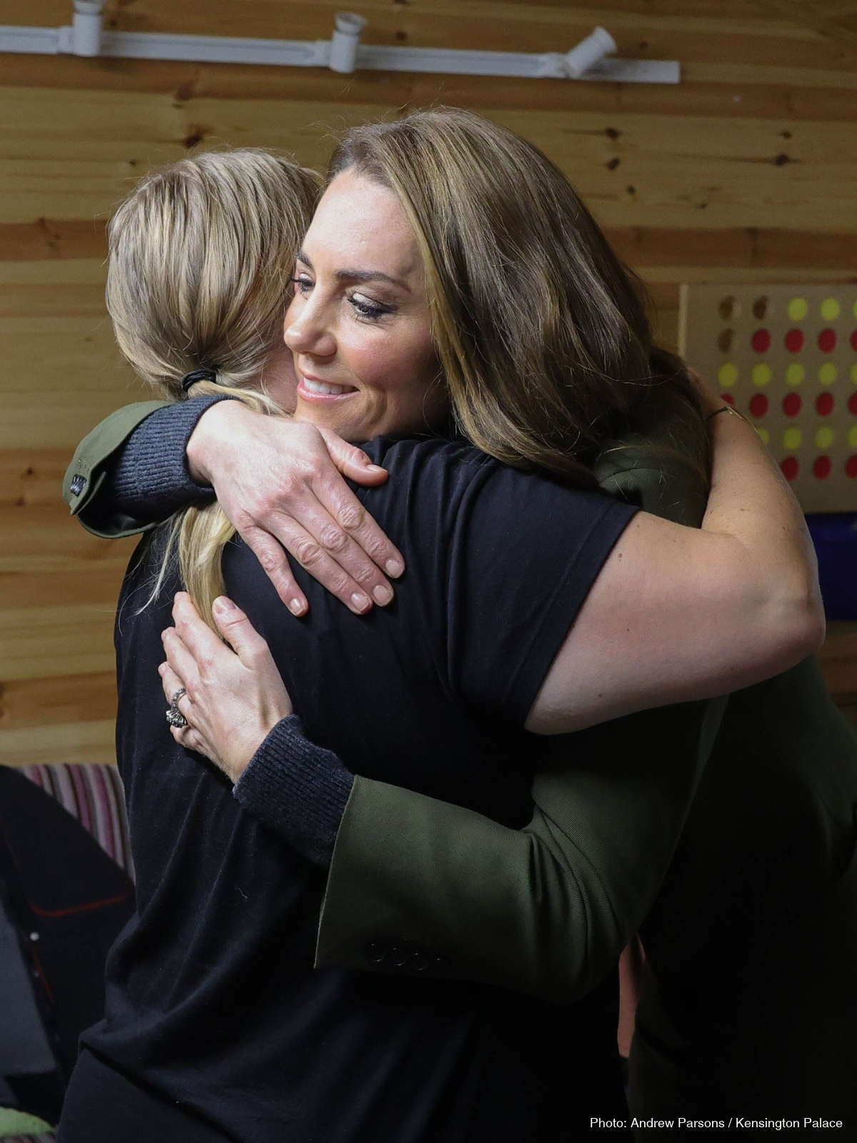 Kate Middleton embracing a woman during her visit to The Treehouse hospice