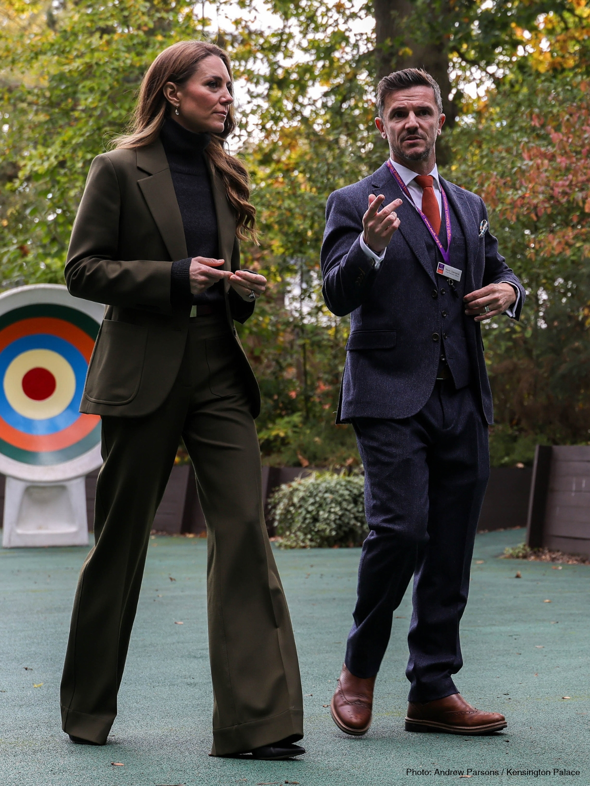 Kate Middleton wearing a Marsh Green Victoria Beckham suit with a charcoal polo neck and burgundy belt