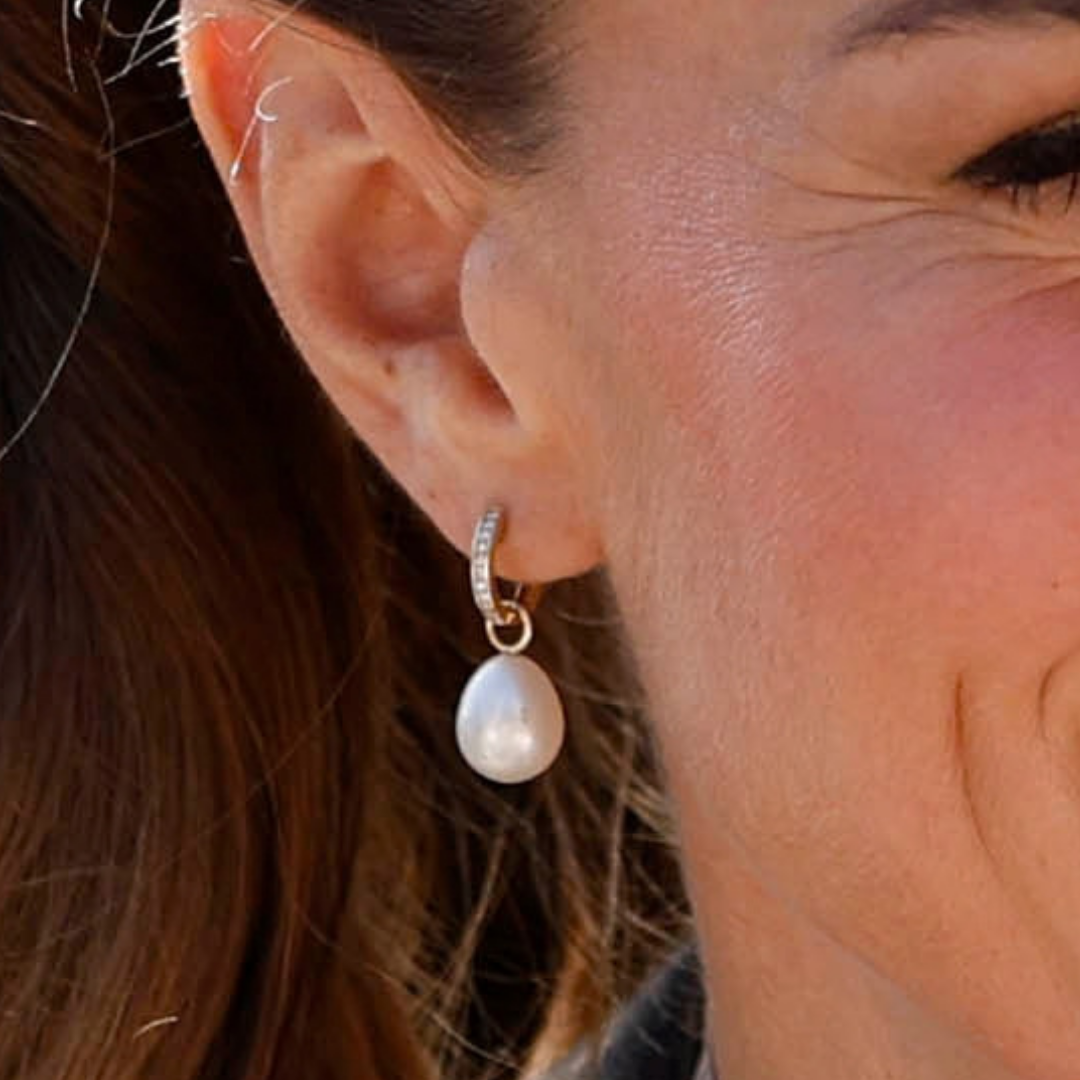 Close-up of Kate’s Annoushka pearl drops suspended from gold diamond hoops