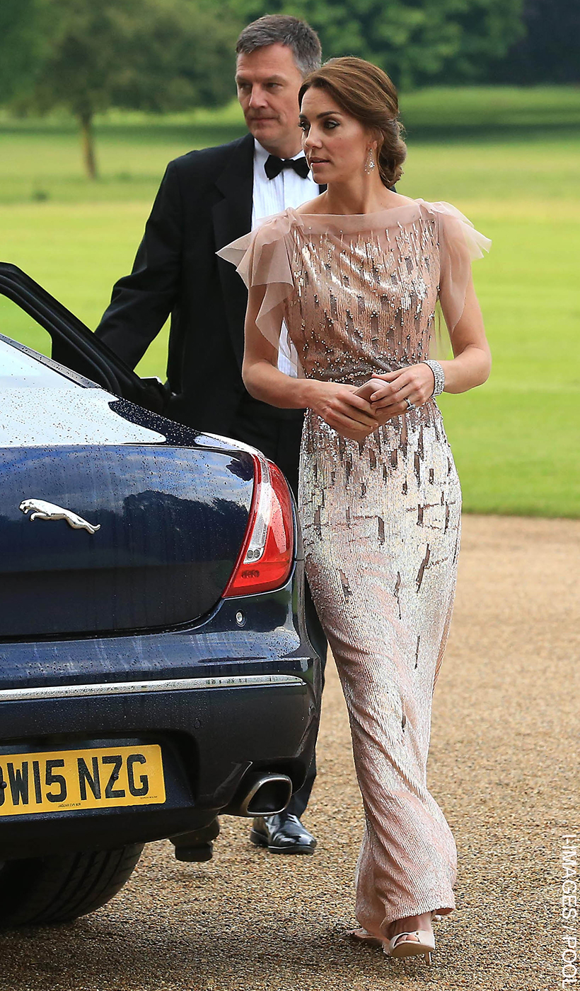 Kate wearing the pink pearlescent gown as she arrives at the 2016 EACH gala.  She wears her hair tied up and chandelier earrings.