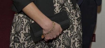 Kate's black bag and gold bracelet.  Image via Majesty Magazine Twitter