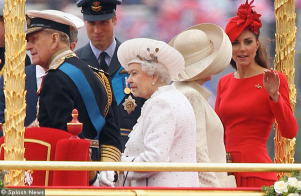 kate wears a red McQueen dress