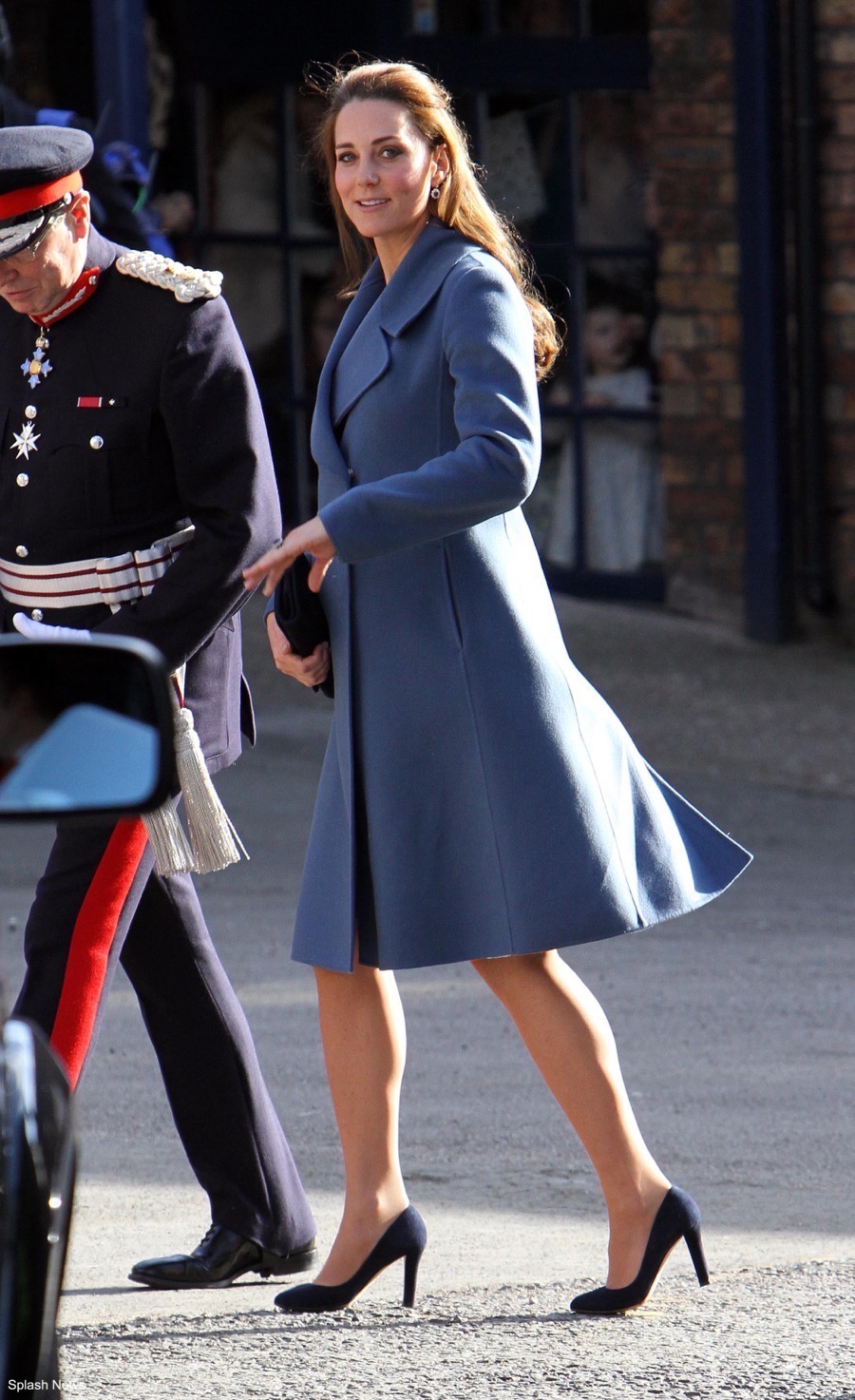 Kate middleton's outfit from Emma Bridgewater visit 2015. Kate was pregnant with Charlotte at the time. She chose this blue coat from Sportmax.