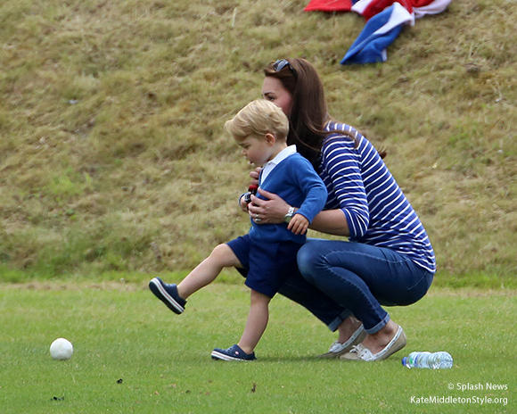 Prince George kicks a ball