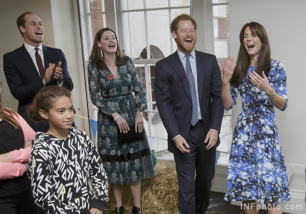 Kate, William and Harry laughing during the welly wanging contest