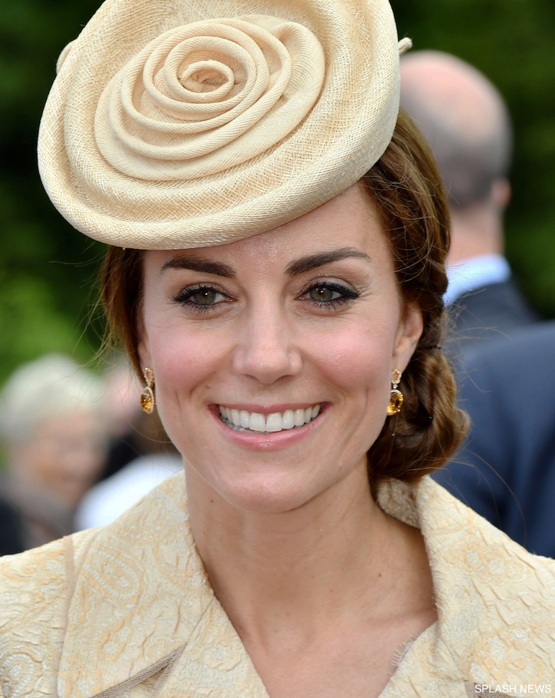 Catherine, Duchess of Cambridge, wearing a cream coat by Day Birger et Mikkelsen and a cream hat by Lock & Co., with Prince William, Duke of Cambridge attend the Secretary of State's annual Garden party at Hillsborough Castle on June 14, 2016 in Belfast, Northern Ireland.
