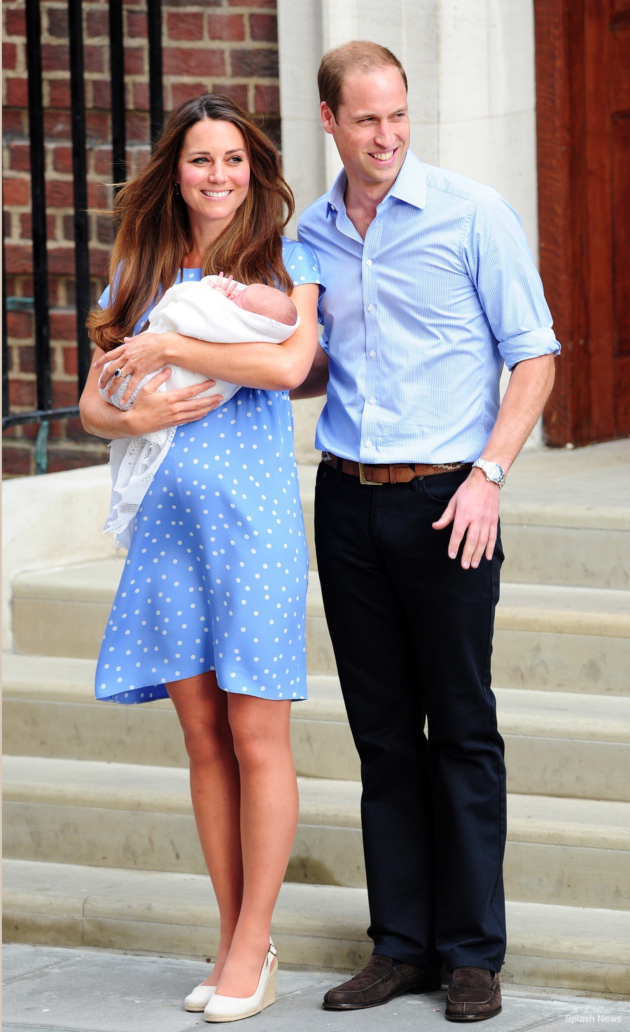 Kate Middleton wears white wedges during the photocall after the birth of her first baby, Prince George of Cambridge
