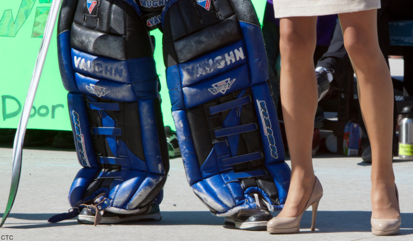 Kate Middleton's nude pumps during a visit to Canada in 2011. She stands next to a hockey player. 