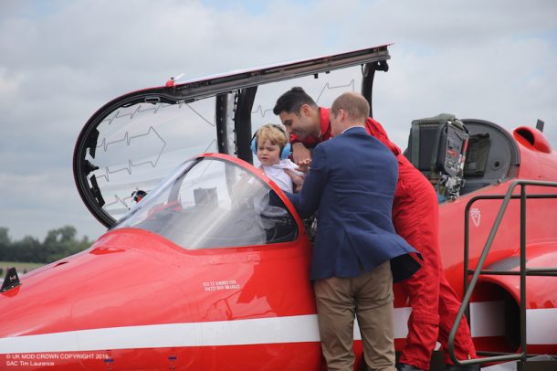 Officers from the Royal Air Force Aerobatic Team, the Red Arrows, had the privilege of meeting the Duke and Duchess of Cambridge with Prince George today (July 7). The Duke and Duchess were visiting the Royal International Air Tattoo, Gloucestershire, where the Red Arrows are displaying. At the airshow, the Duke of Cambridge was given a tour of the Hawk T1, used by the Red Arrows, by Squadron Leader David Montenegro - Team Leader and Red 1. Prince George also got to sit in the world-famous jet.