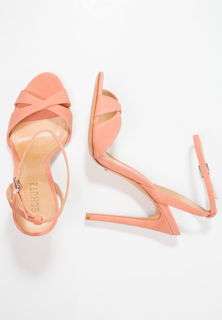 Schutz Dollie Sandals in Clay worn by 