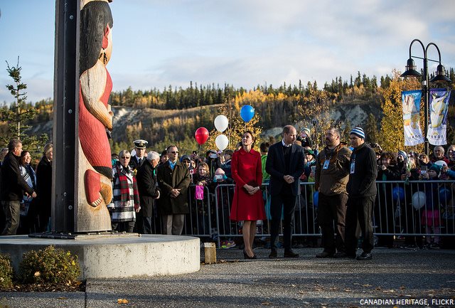 The couple view the Totem pole