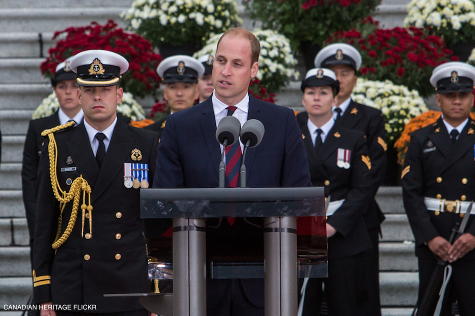 William delivering a speech in Canada