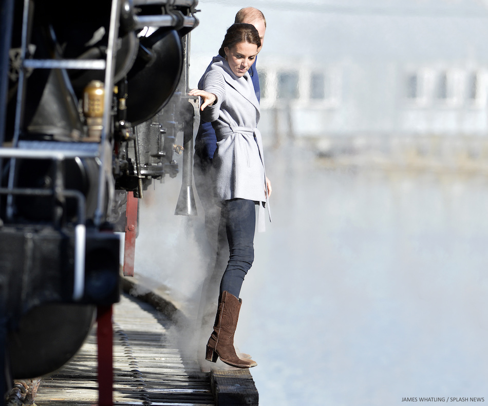 The Duke and Duchess of Cambridge cling on as they negotiate a tricky bridge, after taking a look at a steam train on a visit to Carcross, Yukon, Canada, on the 28th September 2016.