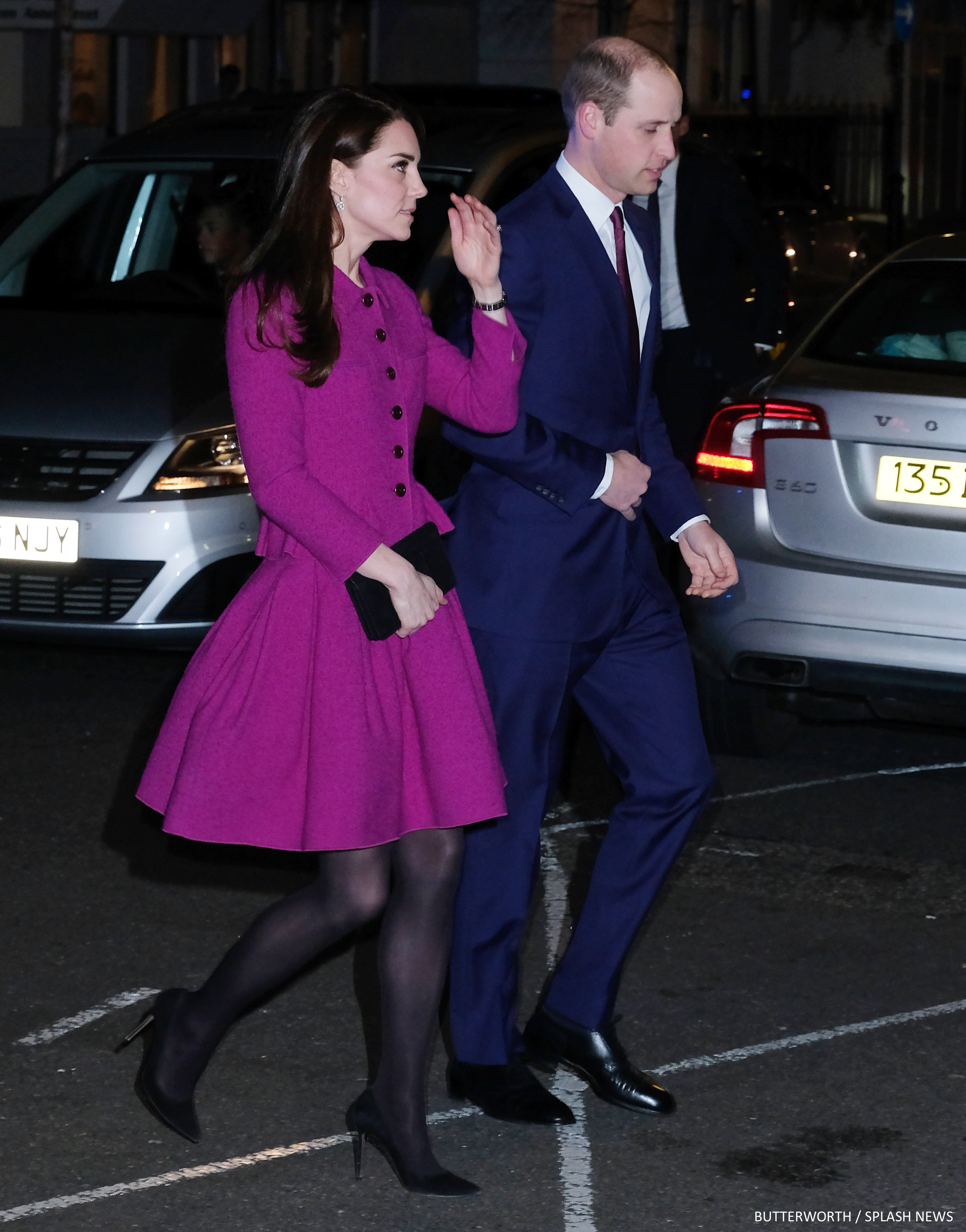 The Duke and Duchess of Cambridge arrive to a charity gala in central London. The Duchess of Cambridge wore a bright purple evening dress as she made her way into the Guild of Health Writer's Conference at Chandos House. 