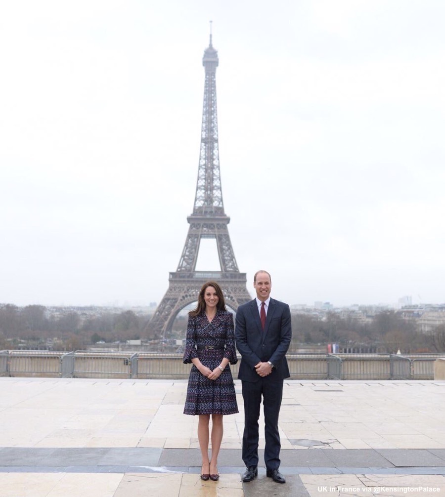 Prince William and Kate Middleton in front of the Eiffel Tower.  The Princess is wearing Chanel. 