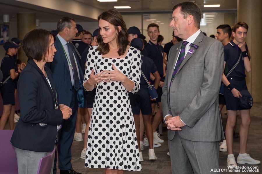 The Duchess of Cambridge with Phillip Brook, AELTC Chairman, and Sarah Goldson, AELTC Ball Boy and Ball Girl Manager, during a visit to The Club on the first day of The Championships 2017 at The All England Lawn Tennis Club, Wimbledon.