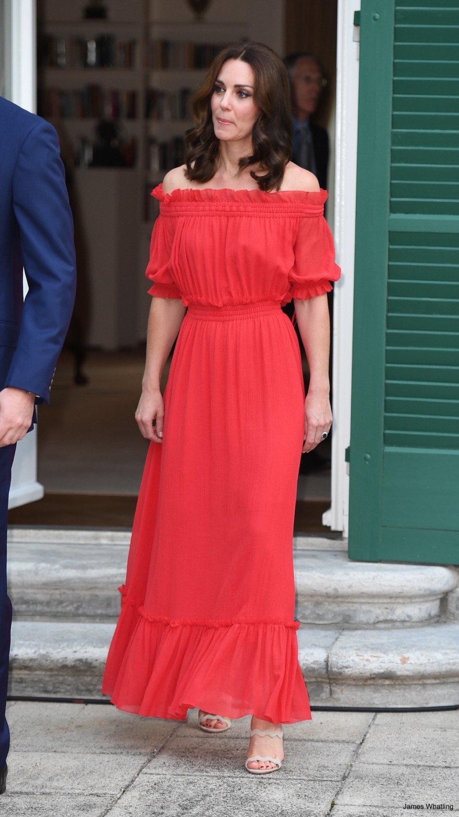 Kate Middleton at a Garden Party wearing Prada sandals with a long red maxi dress. According to our calculations, the Italian company is Kate’s fifth favourite luxury shoe brand.