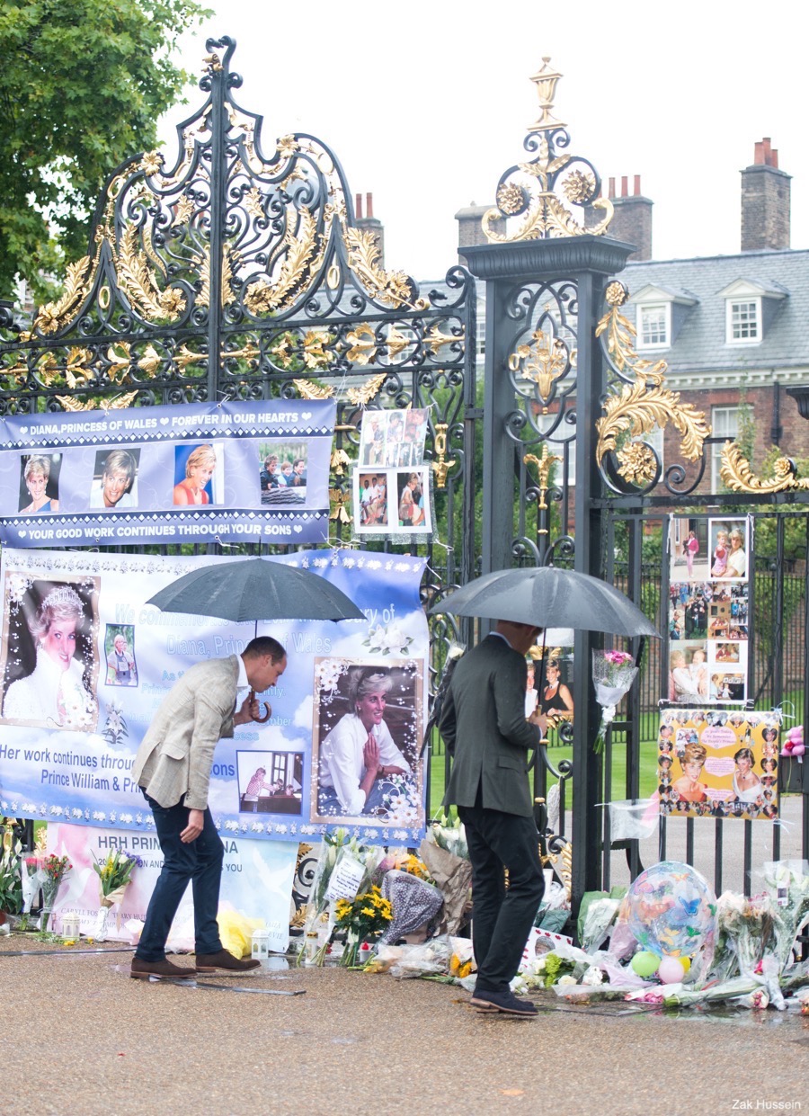 Prince William and Prince Harry viewing tributes at Kensington Palace