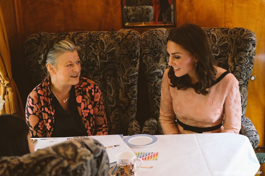 Kate Middleton sitting on the train