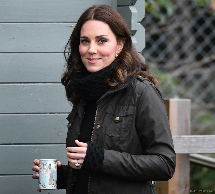 Kate middleton clutching a cup of tea