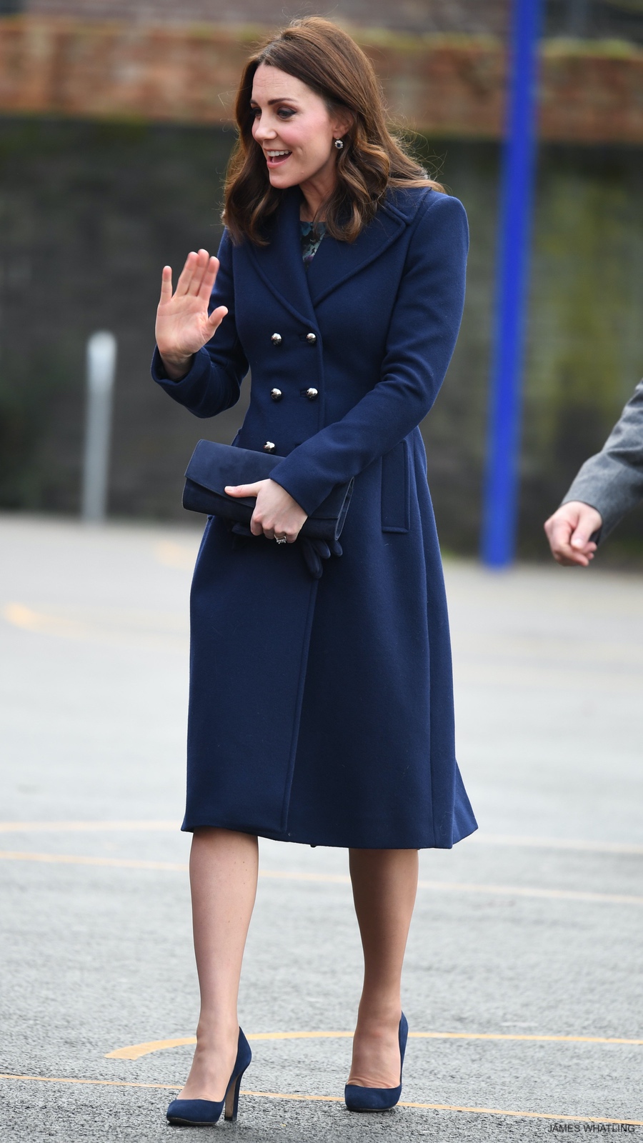 Kate Middleton wearing the Hobbs Gianna Coat and carrying her Stuart Weitzman clutch bag