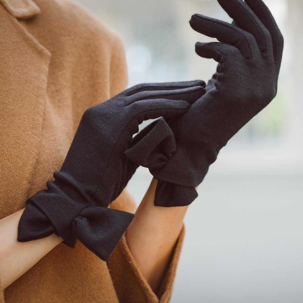 Model shot of the Cornelia James bow gloves.
