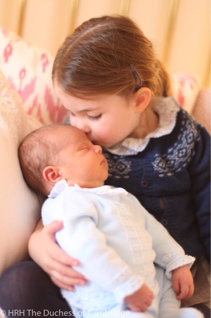 Photograph of Princess Charlotte kissng Prince Louis taken by HRH Duchess of Cambridge