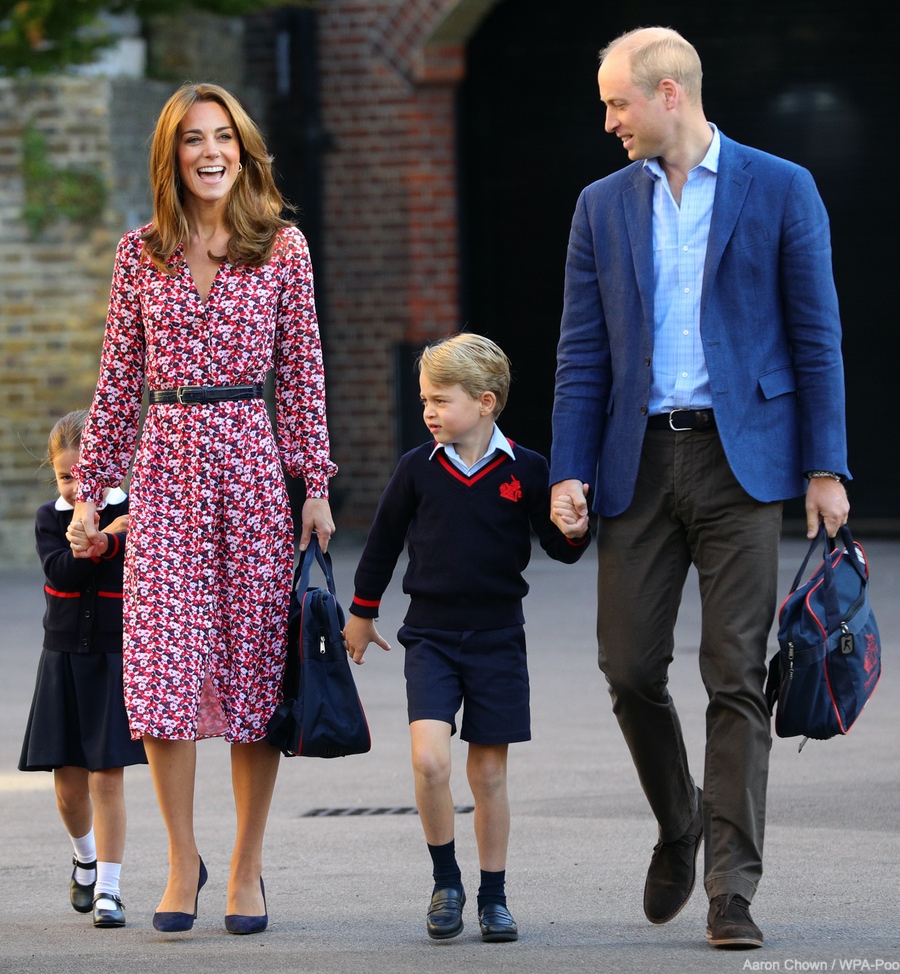 Shy Princess Charlotte hides behind mother Kate during the "school run".