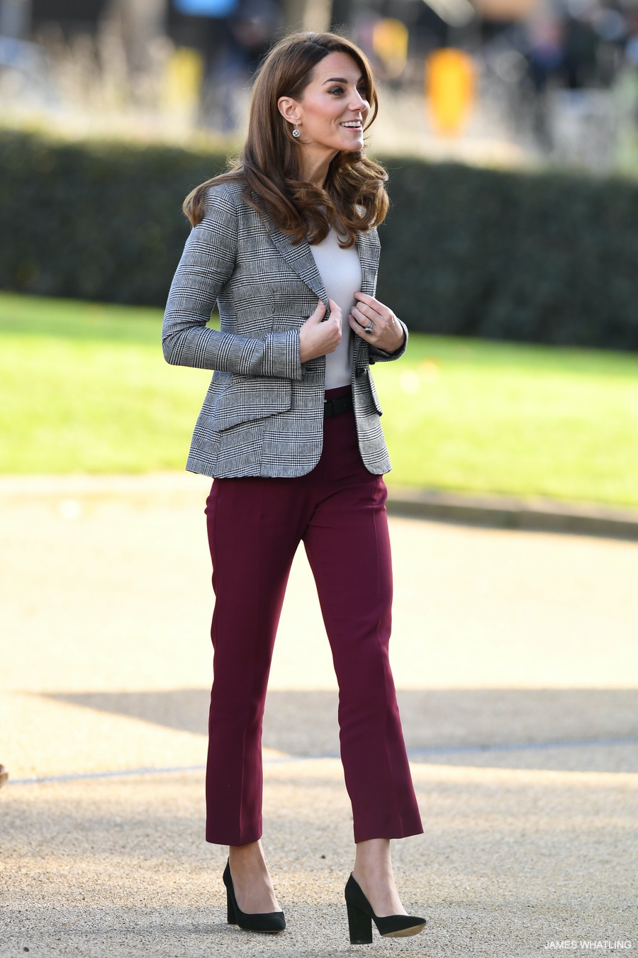 Kate Middleton looks chic in this checked blazer and berry-coloured trousers