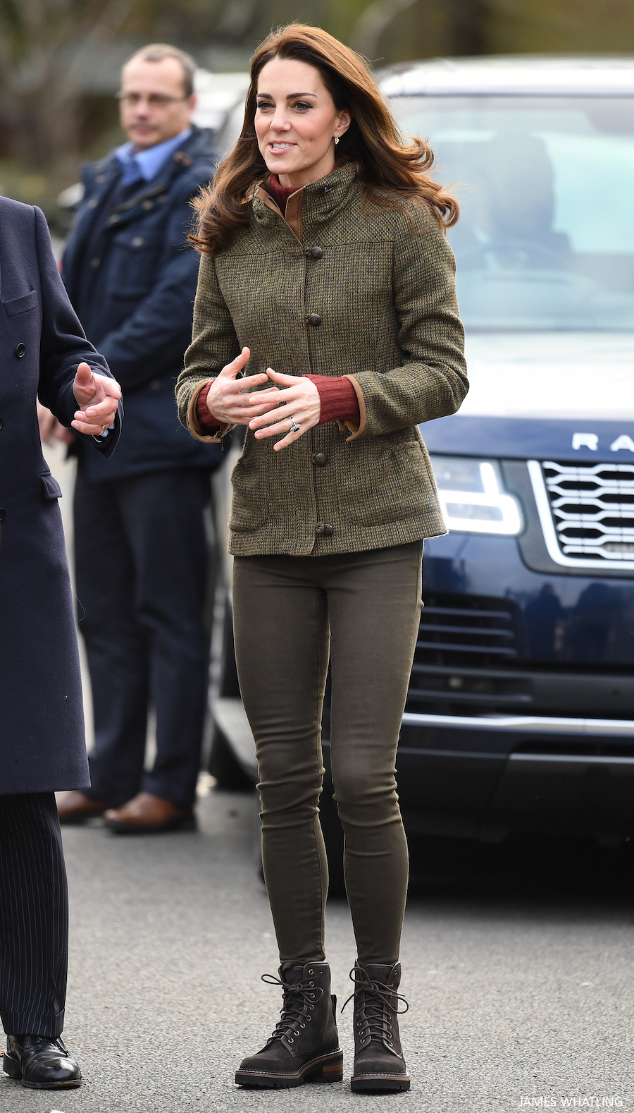 Kate Middleton wearing the Dubarry tweed jacket in the colour 'heath.'  The Princess is also wearing a dark red coloured roll neck sweater, khaki green skinny jeans and brown boots. 