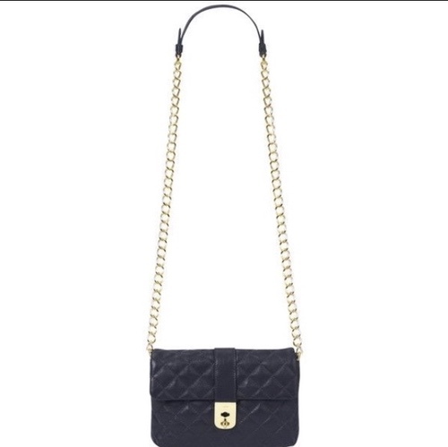 Kate Middleton carrying the Jaeger Kate Bag in Navy Quilted Leather