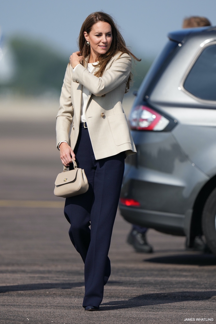 Kate Middleton holding the taupe Mini Holly bag by Tusting at RAF Brize Norton.  She wears a jacket in a similar shade. 

