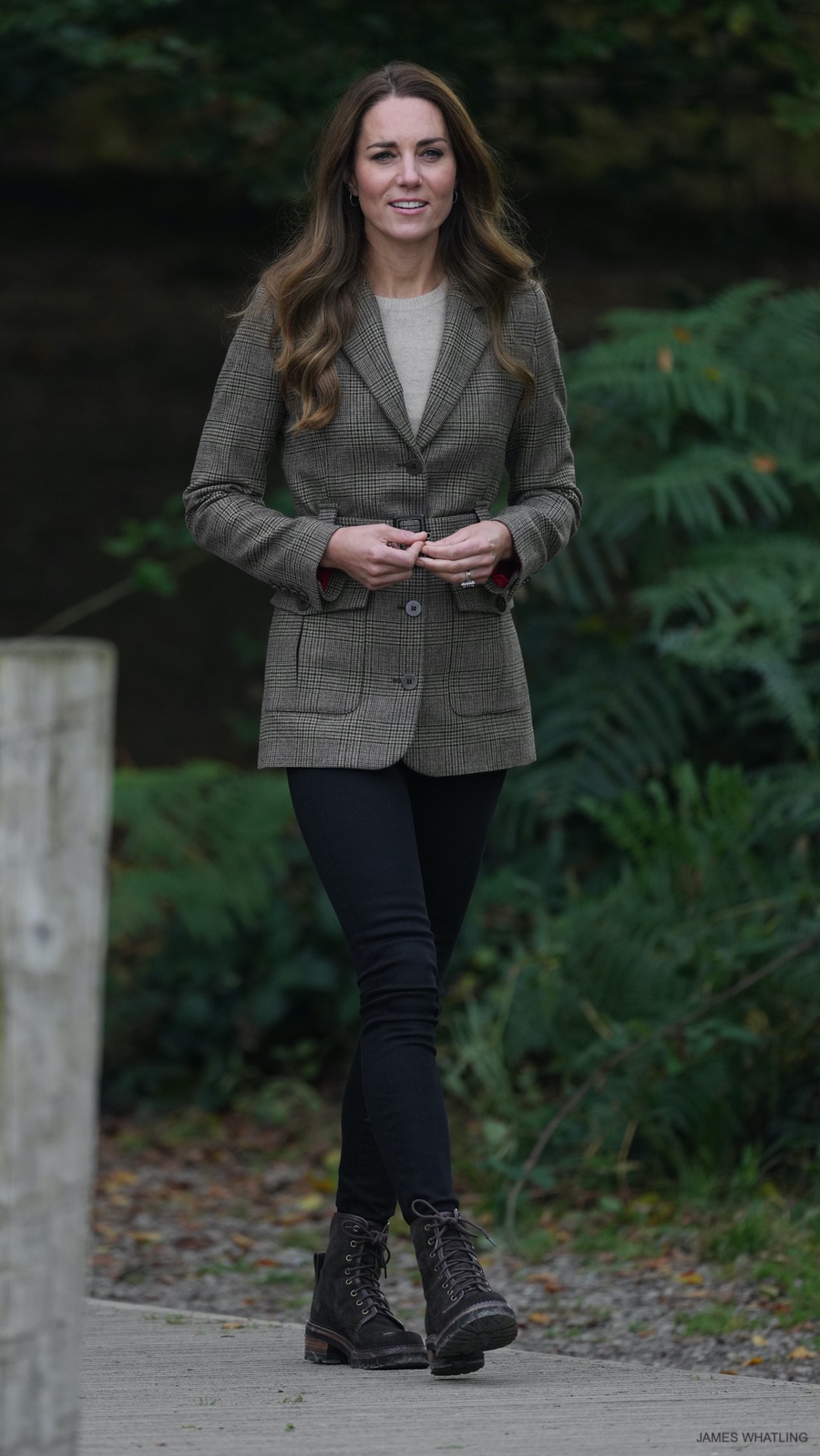 Kate Middleton dressed in a casual outfit during a visit to Cumbria in September 2021.  The Princess paired her brown combat boots with skinny jeans and a longline jacket.