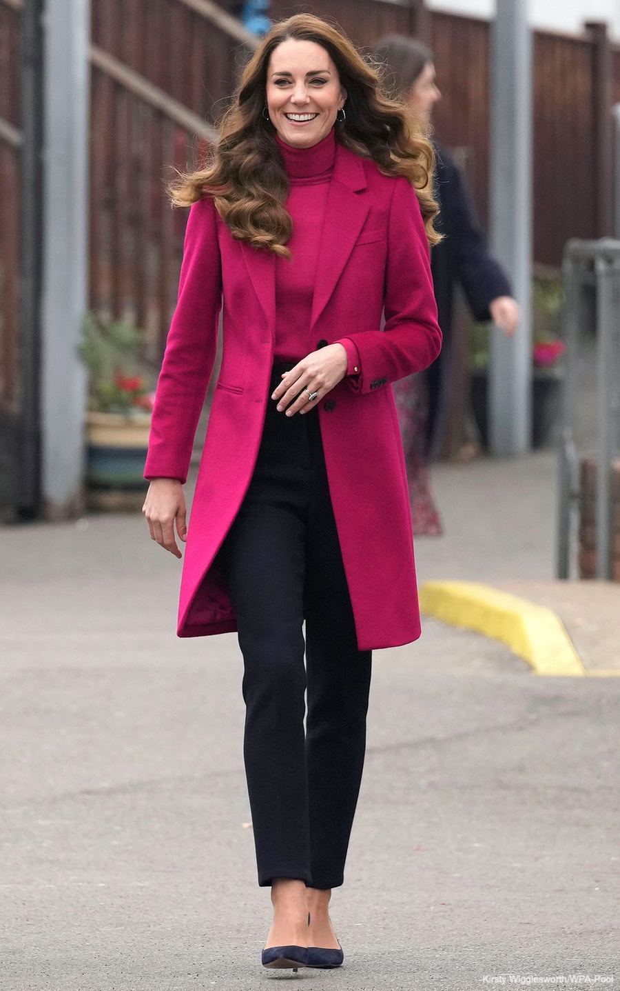 Back to school! Kate wears pink coat & matching jumper for science lesson