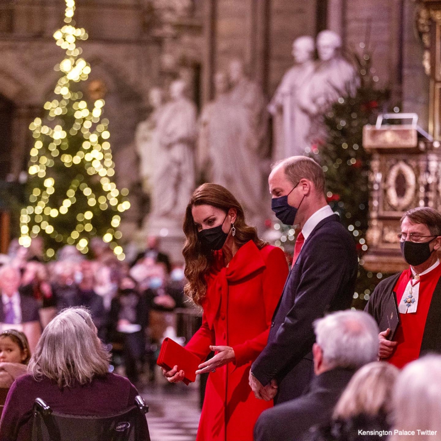 Kate Middleton plays piano during Christmas Carol Service in red bow coat