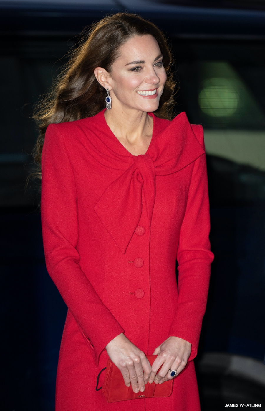 Kate Middleton plays piano during Christmas Carol Service in red bow coat