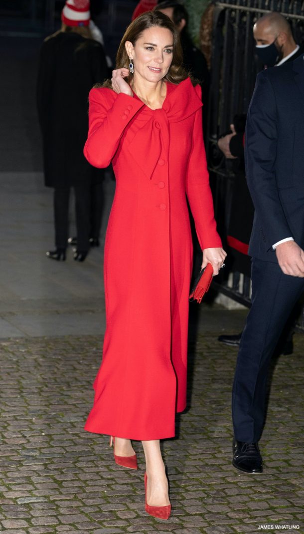 Kate Middleton, the Princess of Wales, wearing the Catherine Walker Beau Tie coat and red heels to her 'Together At Christmas' carol concert in 2021.