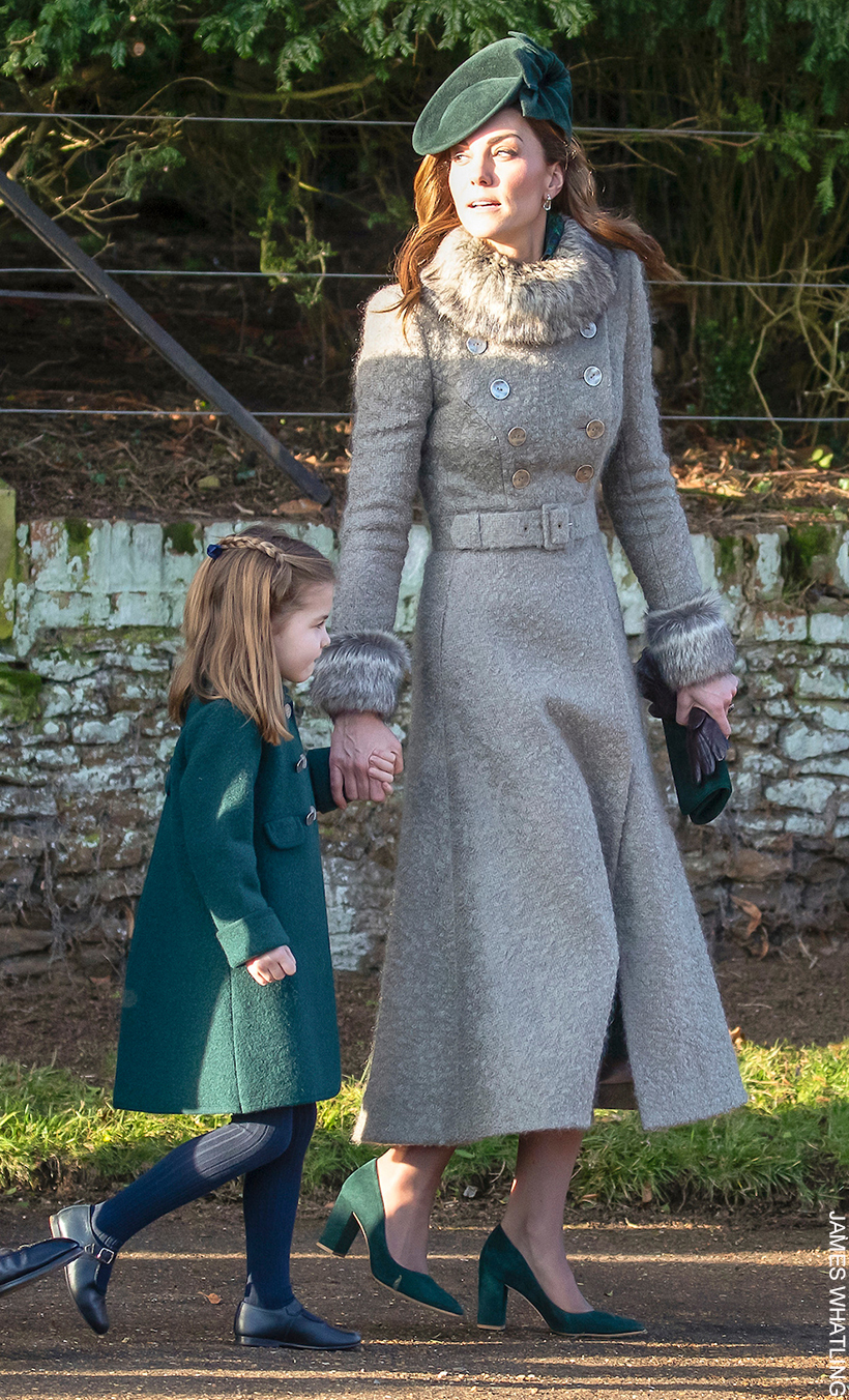 Kate Middleton walking with Princess Charlotte on Christmas Day in 2019.  The Princess wears a winter coat in grey with her green block heel pumps.