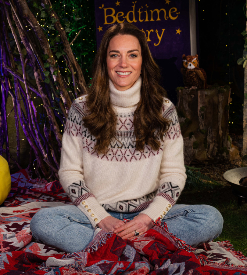 Kate Middleton during the Cbeebies bedtime story programme.  The Duchess wears a cream coloured fair isle knit sweater with blue jeans