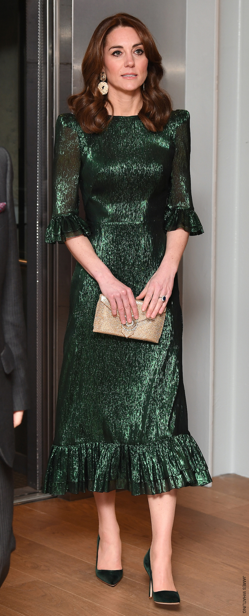 Kate Middleton in a striking green shimmery dress by The Vampire's Wife.  Vogue called this a 'major moment in royal dressing.'