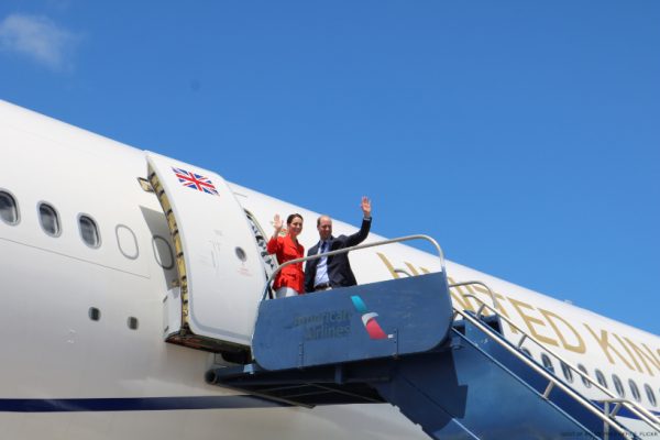 Kate Middleton's Red Jacket & White Trousers leaving Belize + Sea Diving