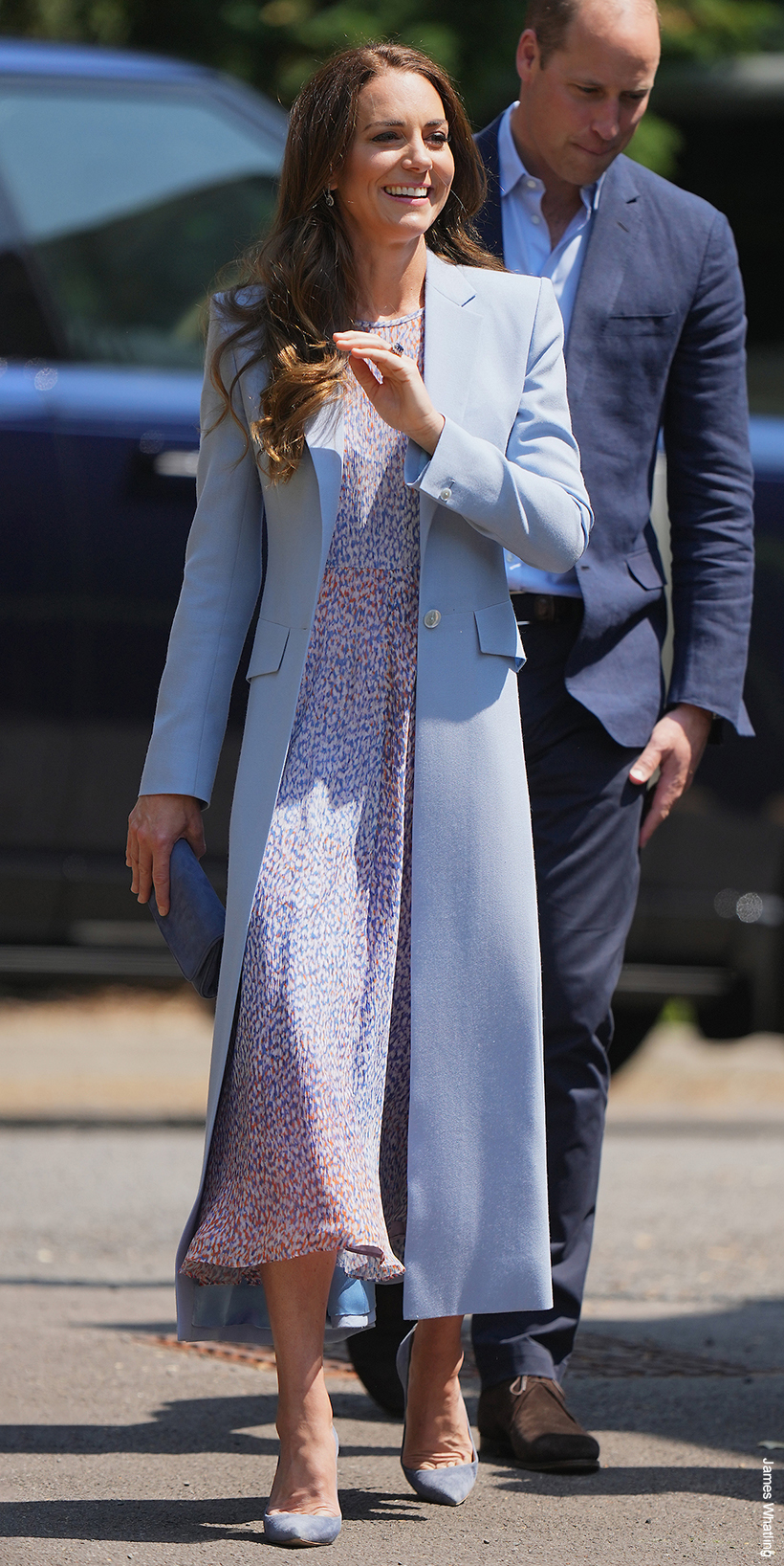 The Princess of Wales embraces a coat in spring, worn over a printed floral dress.